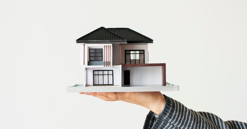 hand-presenting-model-house-home-loan-campaign-1024x537