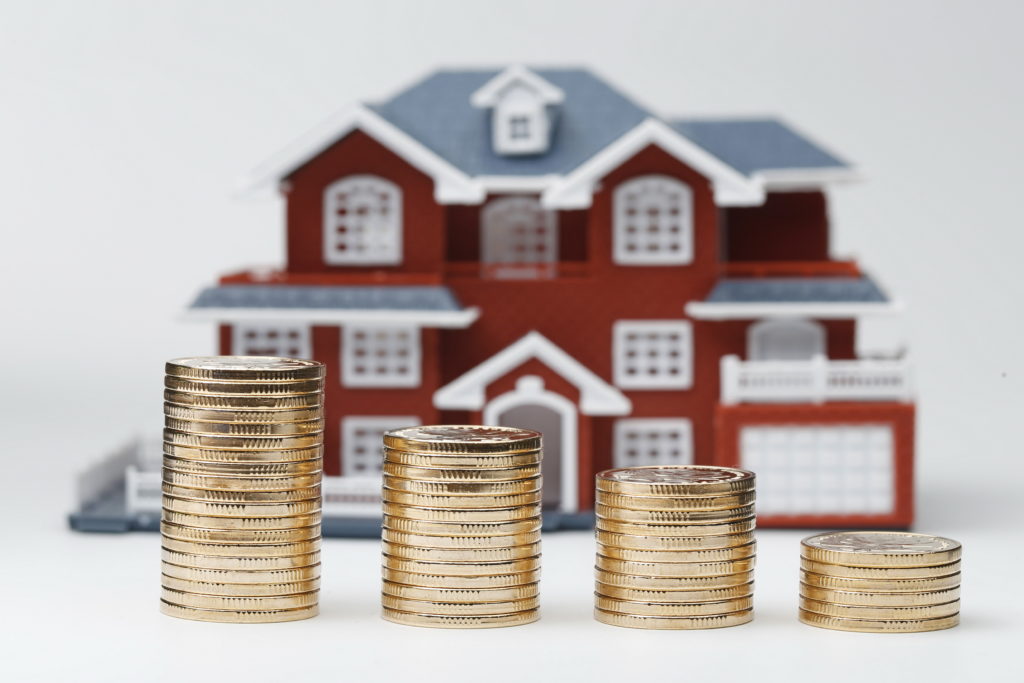 rmb-coins-stacked-front-housing-model-house-prices-house-buying-real-estate-mortgage-concept-1-1024x683